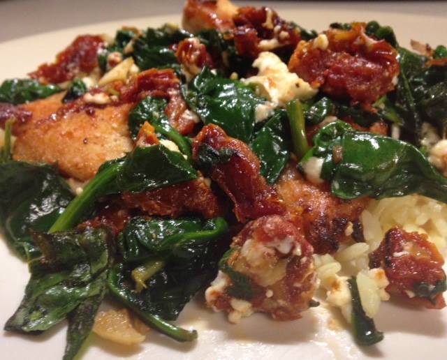 Browned Chicken Strips Covered in Spinach, Sun-Dried Tomatoes, and Feta Cheese